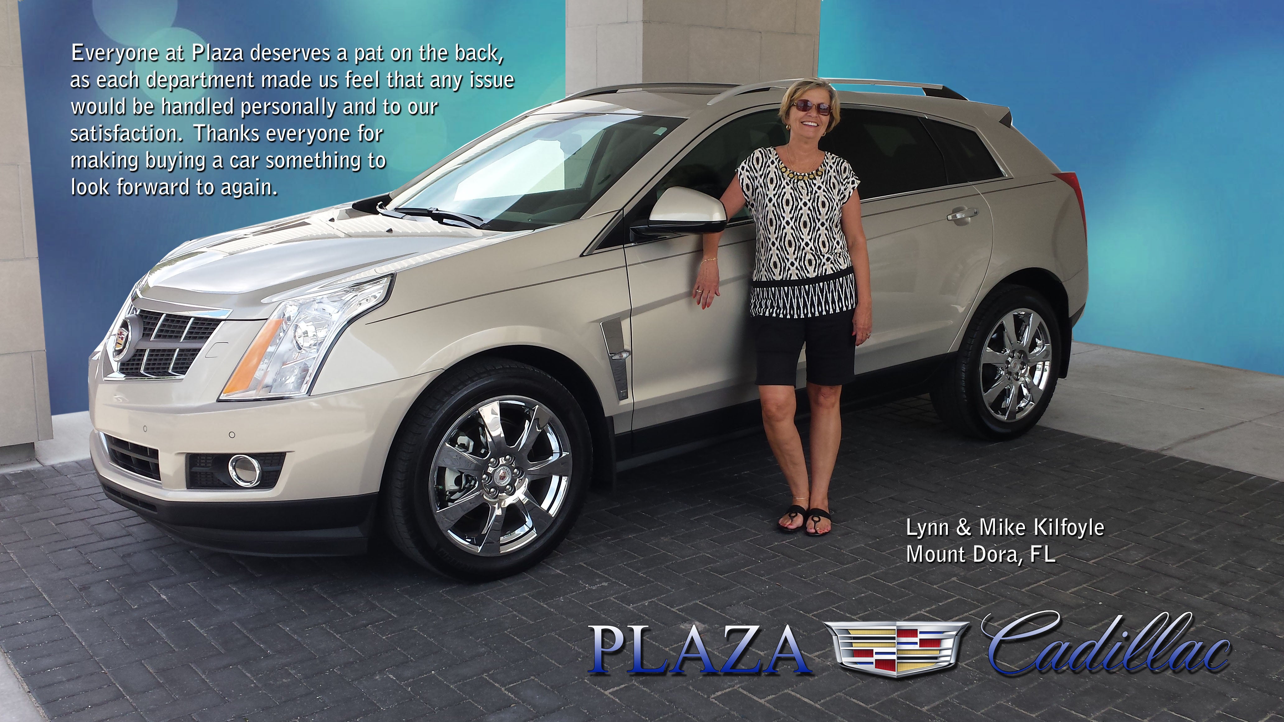 A woman next to a white Cadillac