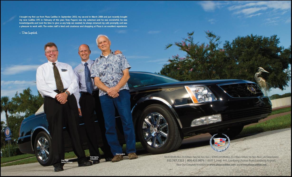 3 men next to a black Cadillac
