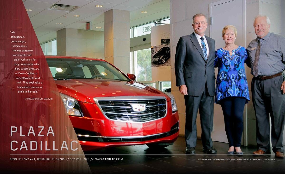 3 adults next to a red Cadillac